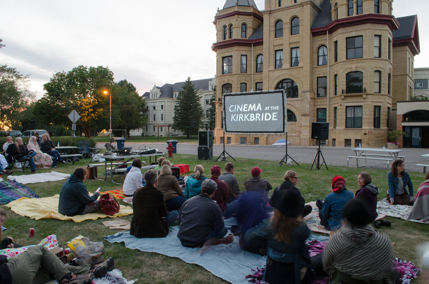Fergus Falls residents gather for a movie on the grounds of the former state hospital.
