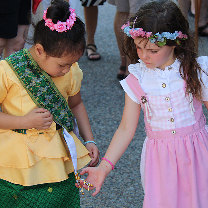 two girls who are dressed in traditional clothings