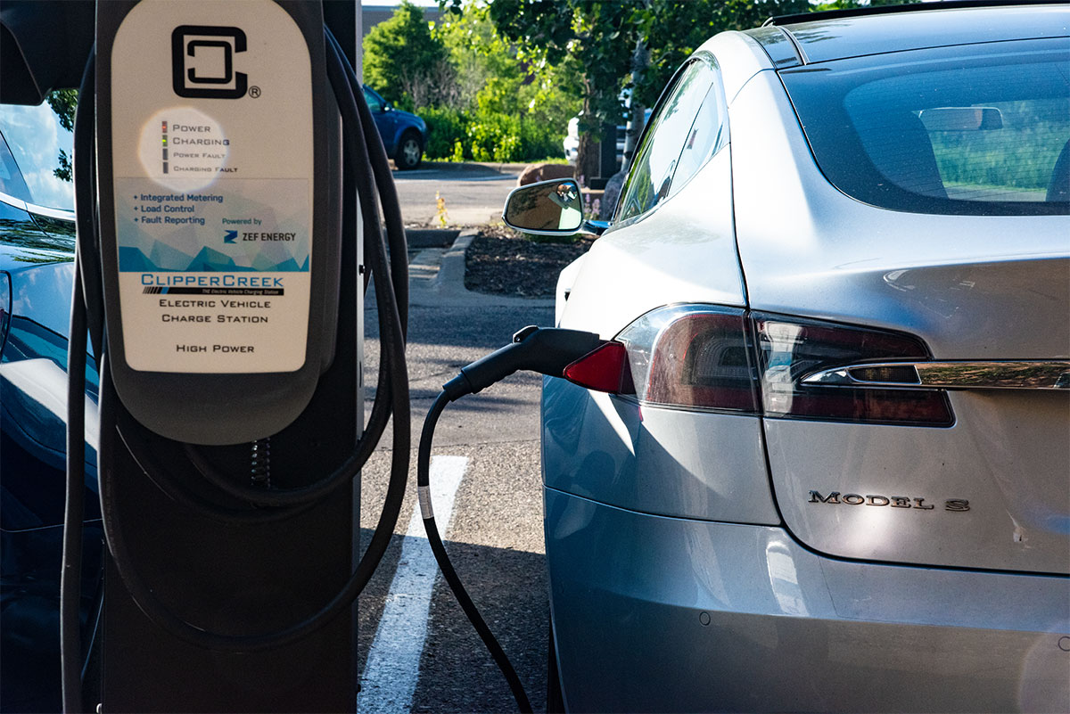 Electric car connected to a charging station.