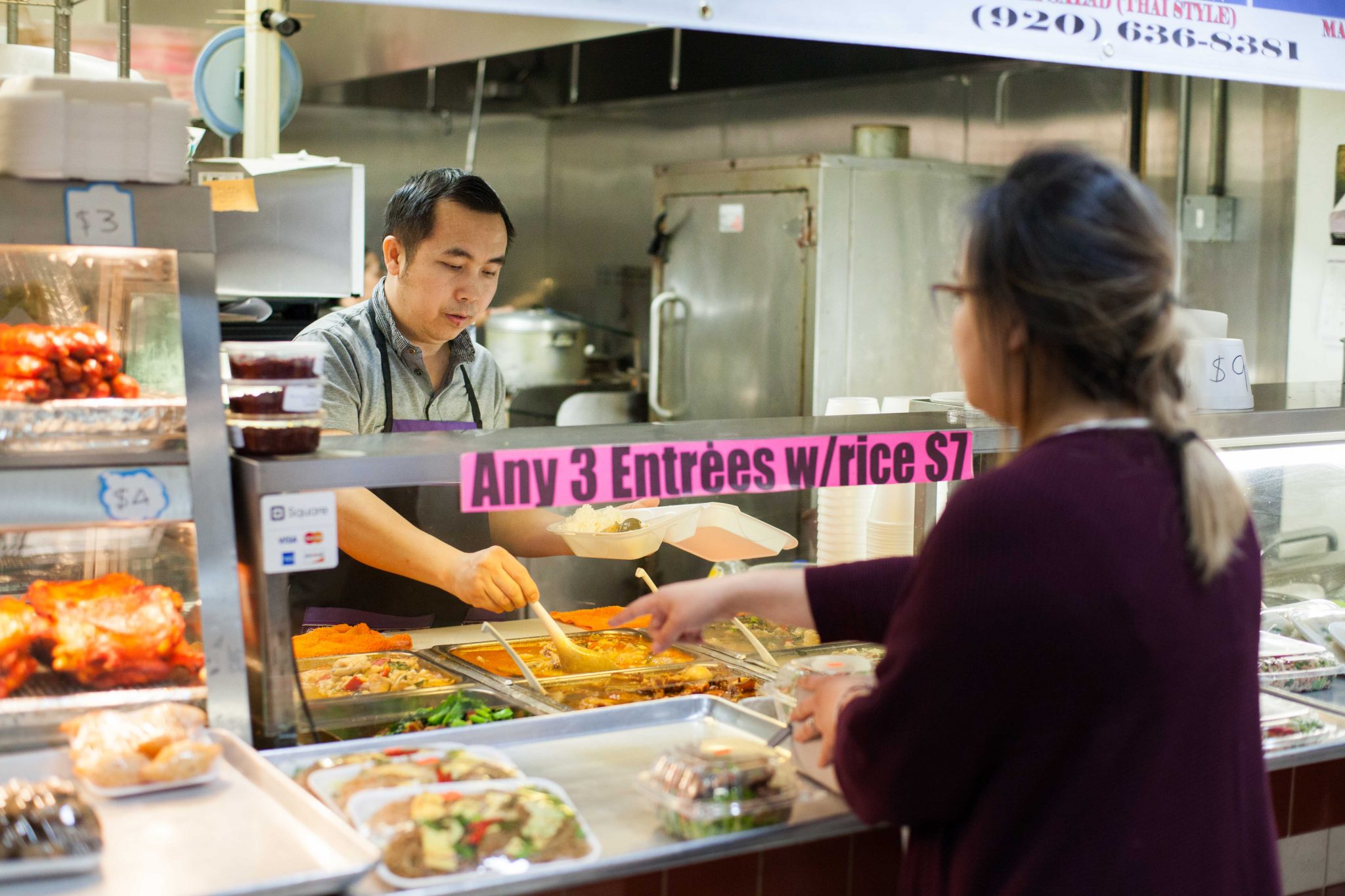 a man serving a women some food