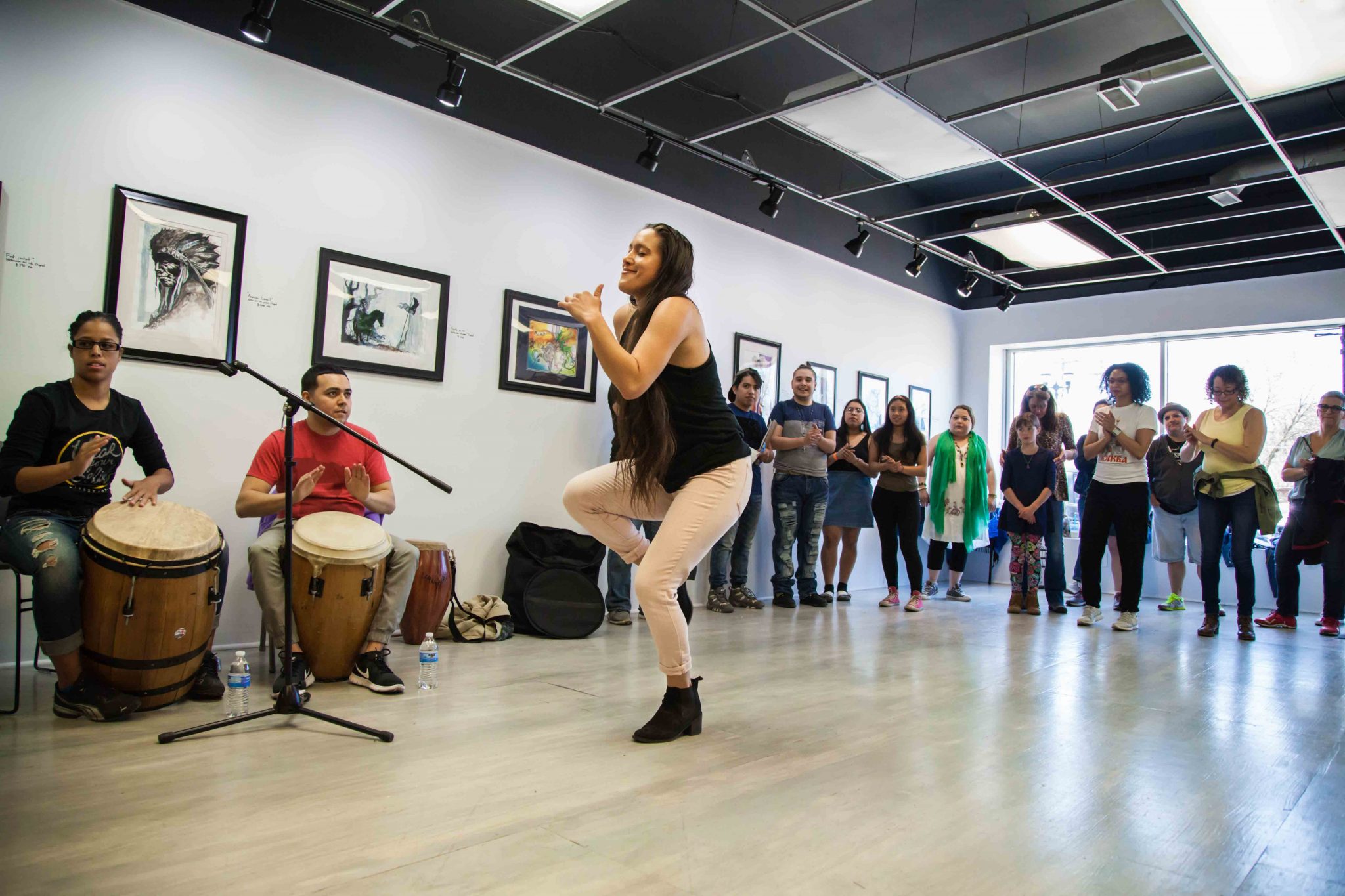 woman dancing for a group of people