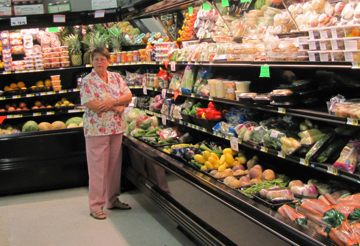 woman standing in a grocery store