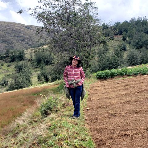 Katherin Meza in farm fields in Huancayo, Mantaro Valley, Peru.