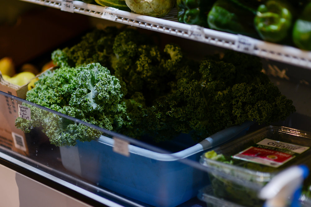 curled kale vegetable in a blue basket