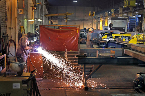 a man cutting something by grinder