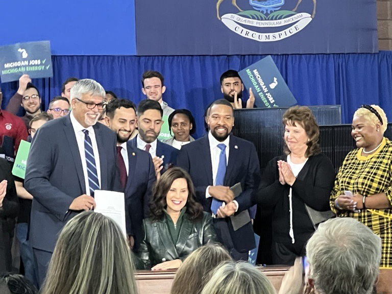 Michigan Governor Gretchen Whitmer signs 100 percent clean energy laws. Photo credit: Ben Passer