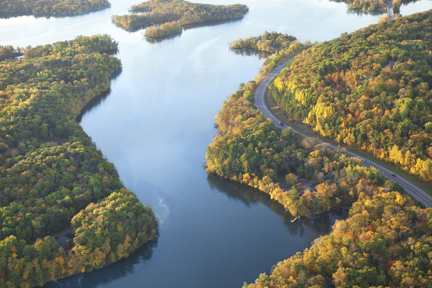 a view of the Mississippi River surrounded by trees