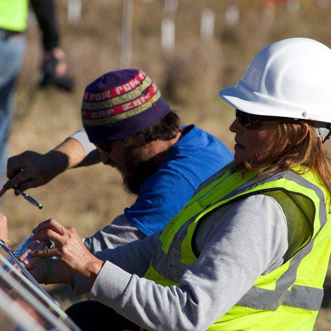 two people who are doing construction work