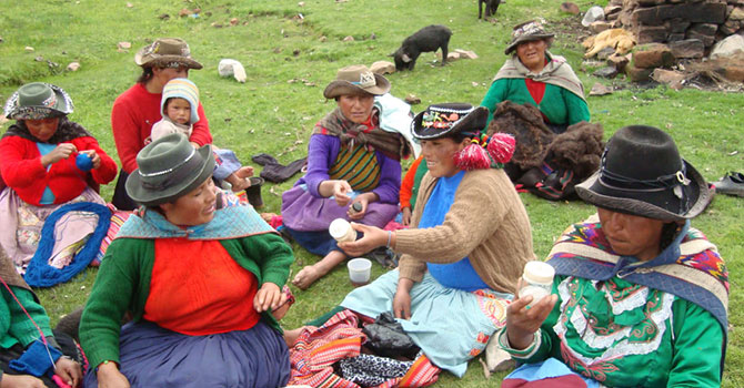 women sitting down and having a drink