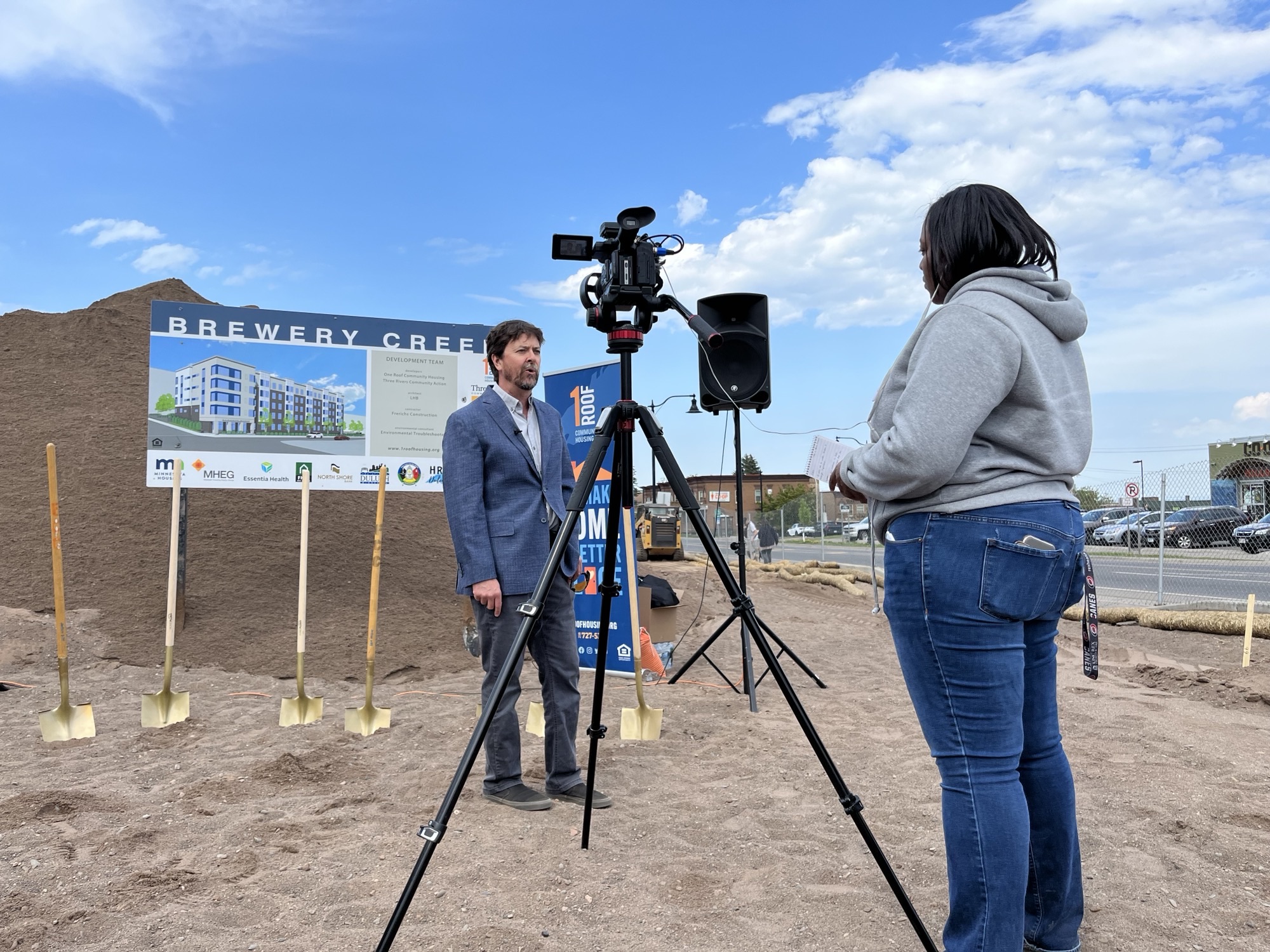 Jeff Corey speaks to media at the groundbreaking for the new Brewery Creek Apartments, which will provide 52 units of mixed-income housing in Duluth's Hillside neighborhood. Photo credit: One Roof Community Housing