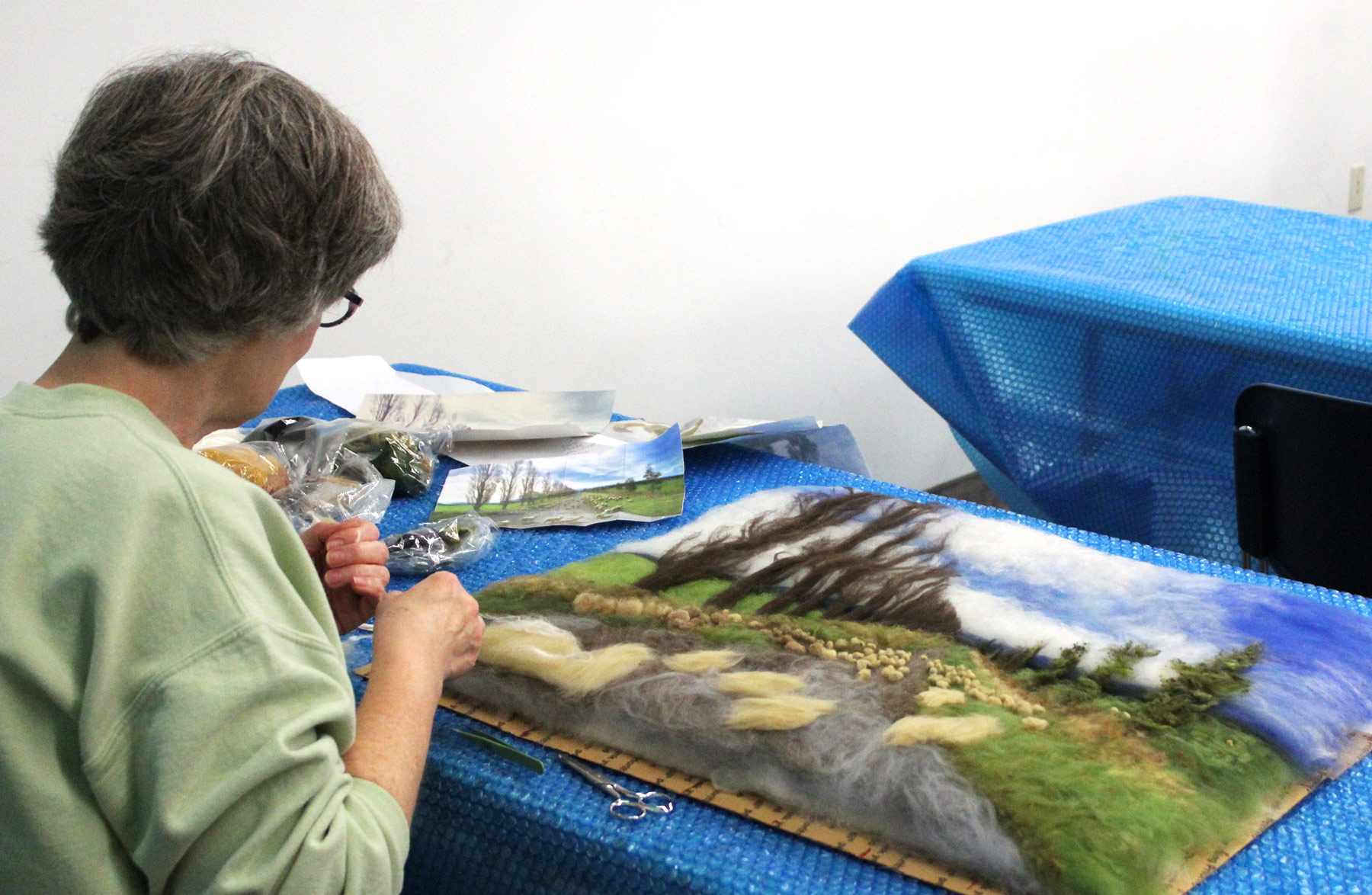 A women sharpens her fiber art skills in Textile Center’s dye lab. Photo Credit: Tracy Krumm